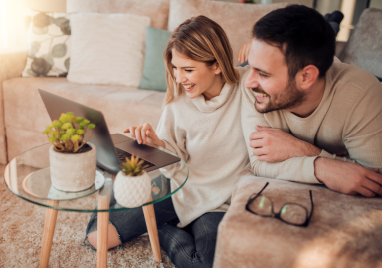 couple watching something in the laptop together fun things for couples to do at home