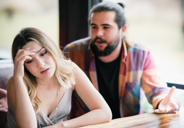 woman looking away from boyfriend how to stop being a narcissist