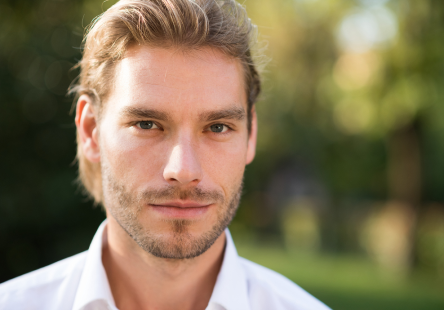 close up shot of a blonde man how to stop being a narcissist