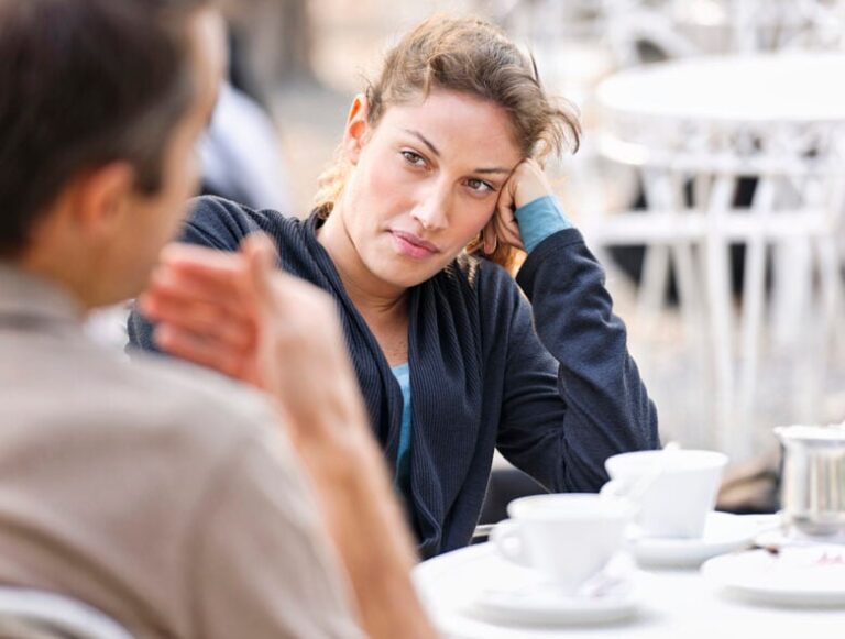 woman staring at someone how to manipulate a narcissist