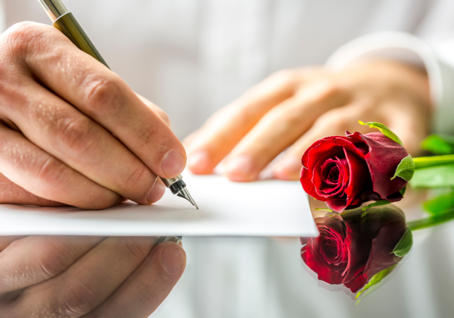 hand writing with a stem of rose love letters for girlfriend