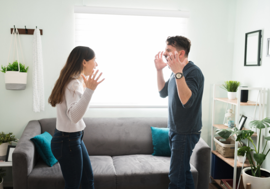 couple standing up while fighting how to stop yelling in a relationship