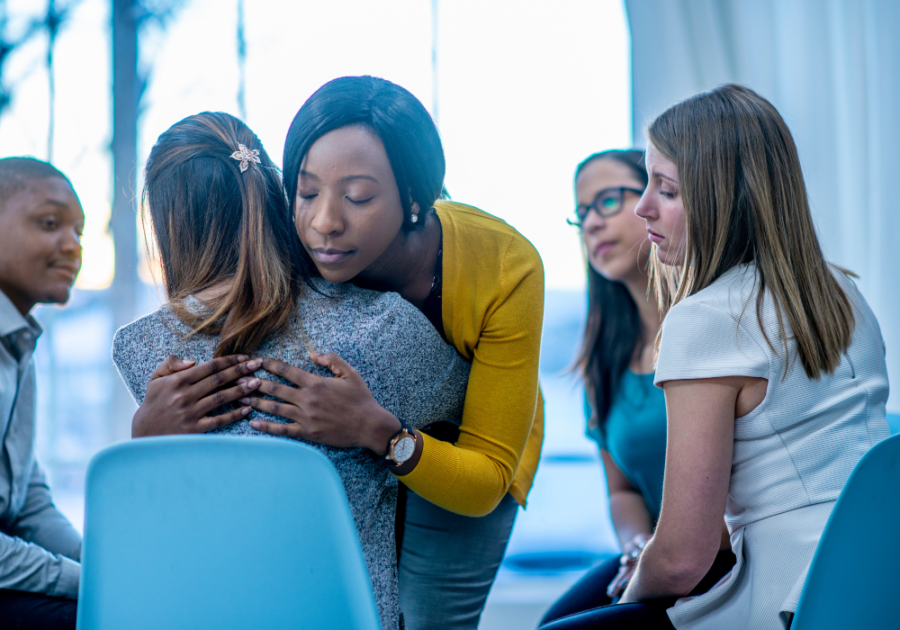 woman hugging another woman with others watching why dont i like being touched