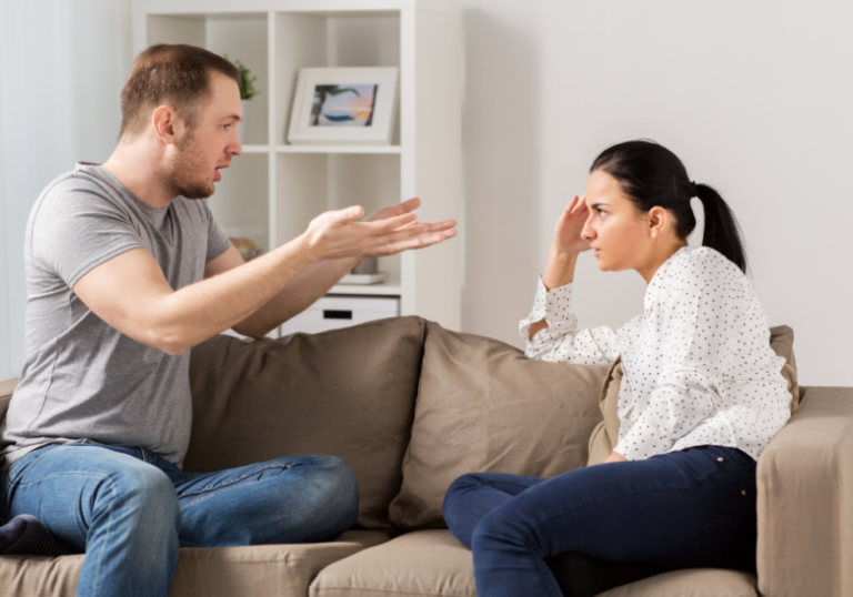 couple having a conversation in the couch stages of a narcissist relationship