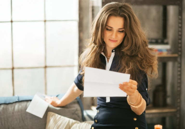 woman reading in a paper love letters for girlfriend