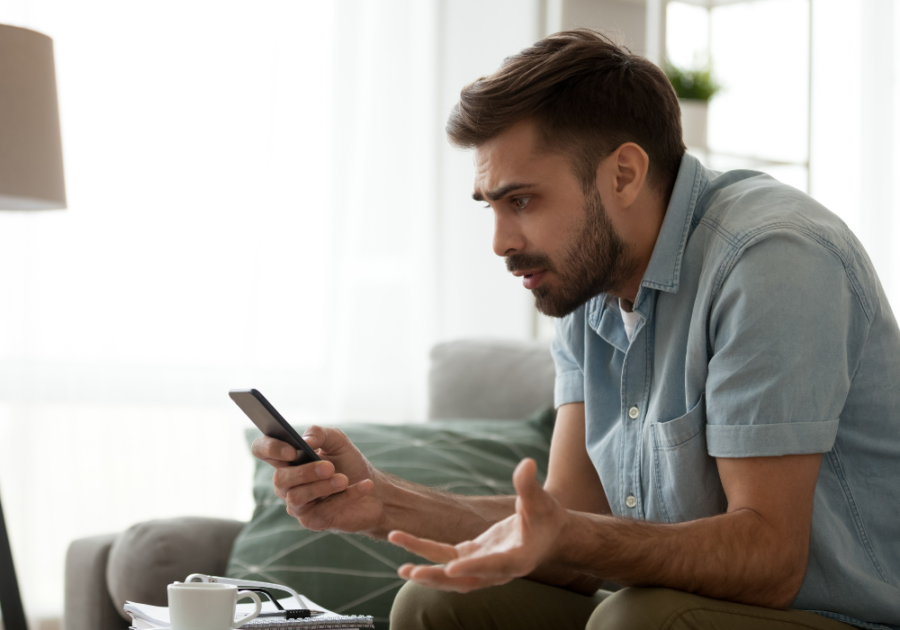 man looking at phone when a narcissist sees you have moved on