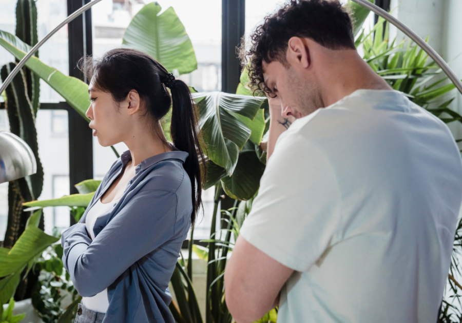 couple standing in area with many plants signs of an immature woman