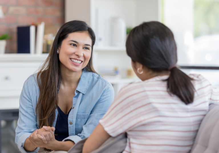 two women talking to each other happily How To Respect The Boundaries Of Others