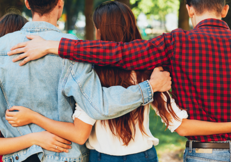 group of friends arms around each other signs a guy is pretending to be straight