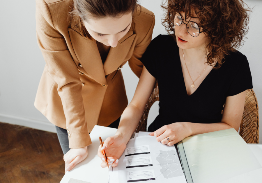 woman working together at office desk beta female traits