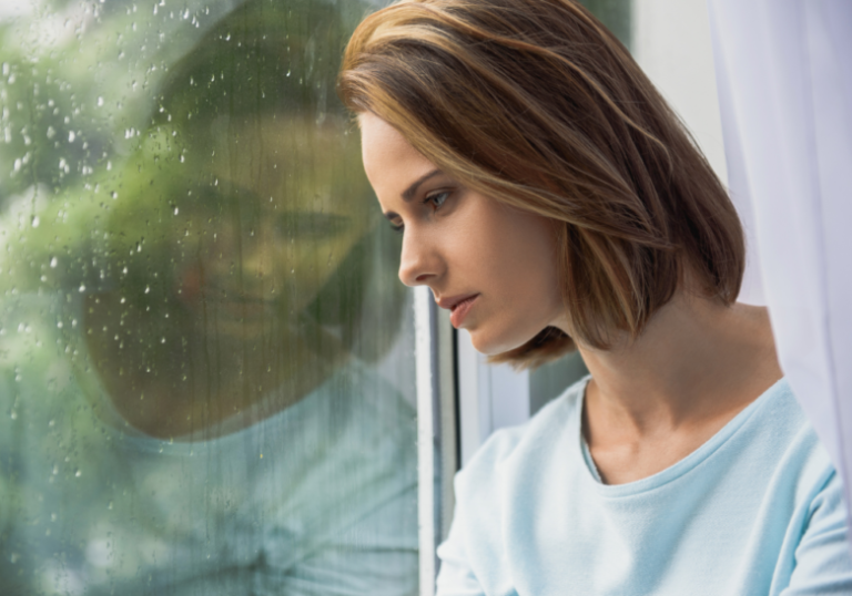 woman leans on the glass window Why is he ignoring me all of a sudden