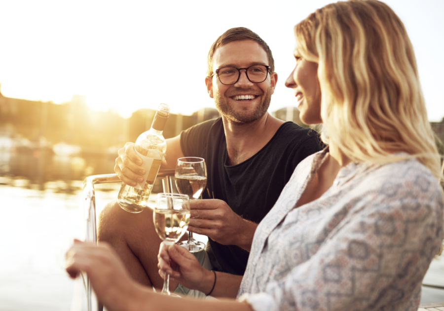 man and woman drinking wine outside Signs an Aquarius Man Likes You 