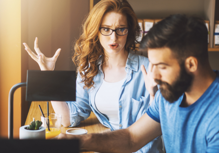 woman talking while man is working red flags in a relationship with a woman