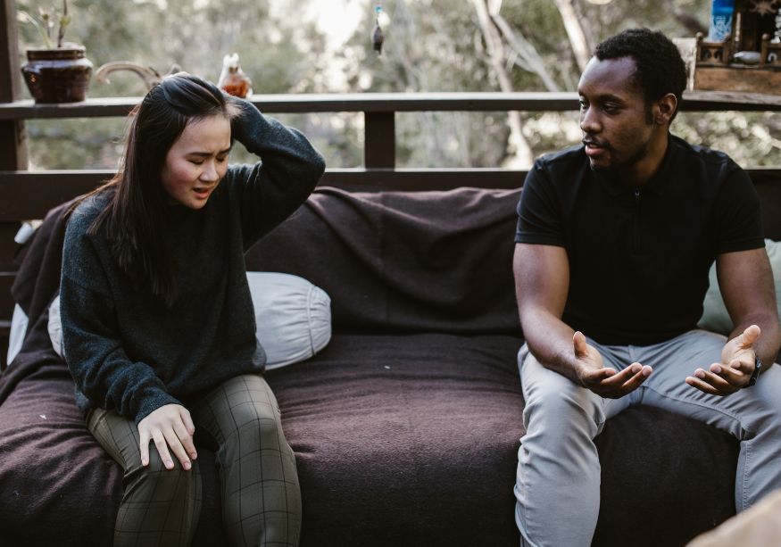 couple talking on sofa woman is upset Narcissistic Projection