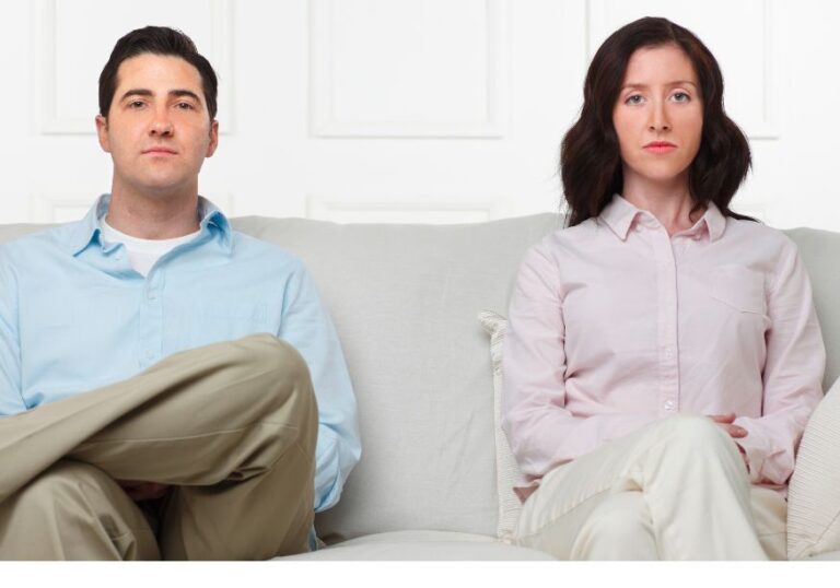 couple sitting on sofa Rules for Living Together When Separated