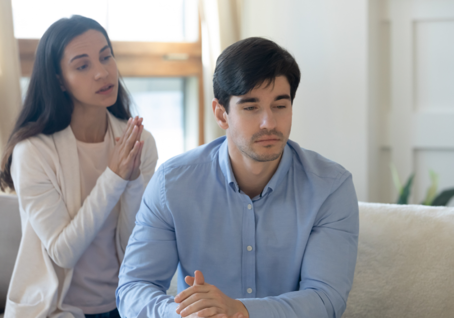 couple on sofa man turned away don't love wife anymore