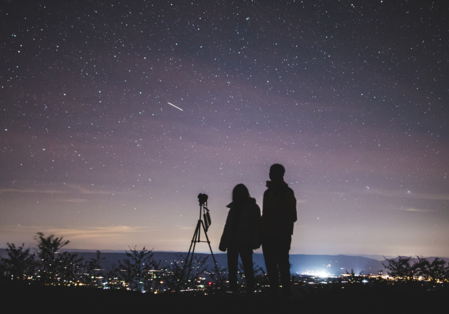 couple looking at night sky with telescope Last-Minute Date Ideas