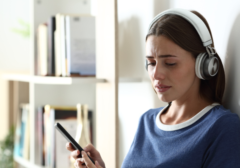 woman crying while listening to music Songs That Will Make You Cry