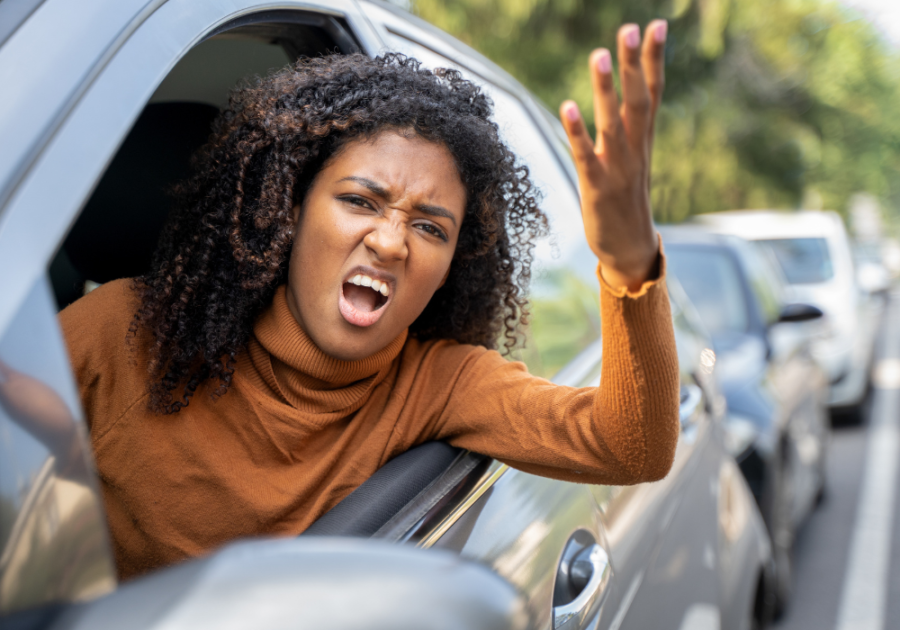 woman leaning outside car yelling toxic personality traits