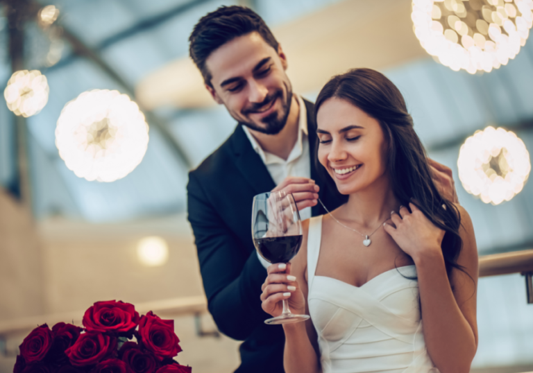 couple drinking standing smiling Couples’ Birthday Ideas