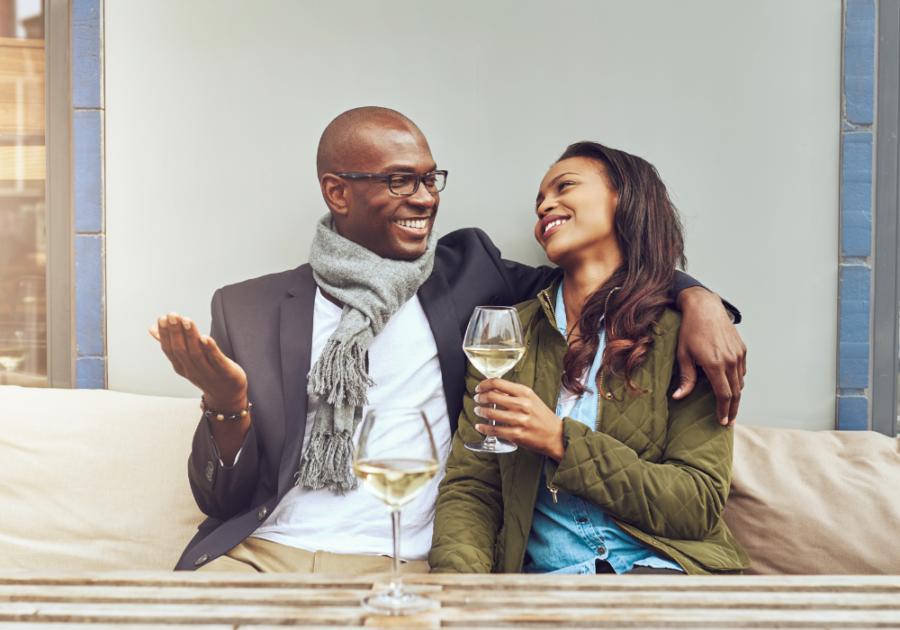 couple sitting together drinking wine Open-Ended Questions to Ask a Girl