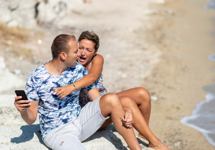 couple arguing on beach Signs He Has Multiple Partners