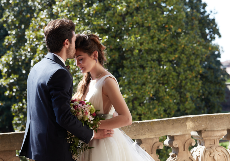 wedding couple man kissing woman's head How to Write a Letter to Your Future Husband 