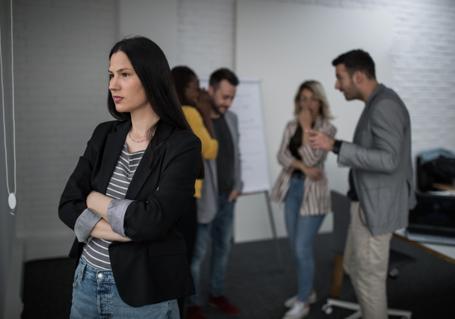 woman standing alone at party toxic personality traits