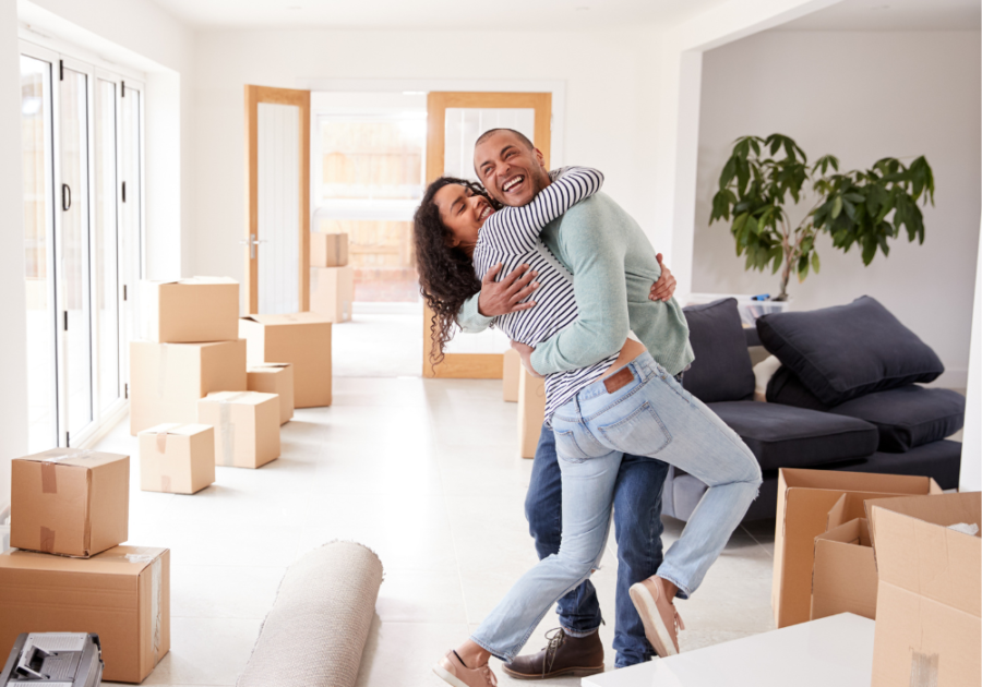 man and woman hugging smiling how to make your boyfriend obsessed with you