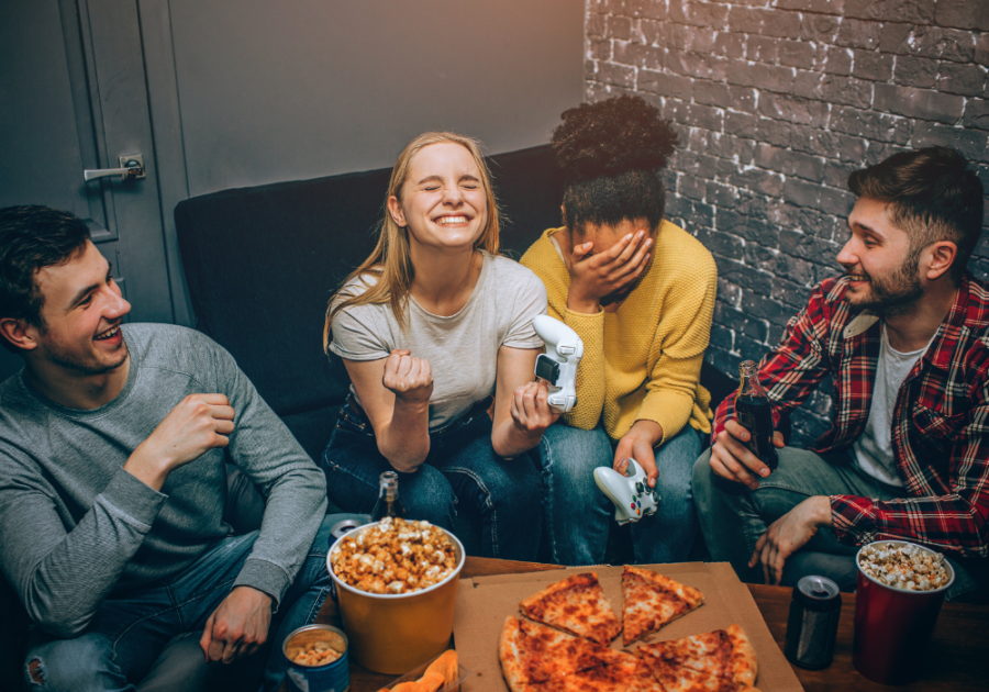 young people eating pizza laughing Paranoia Questions Game