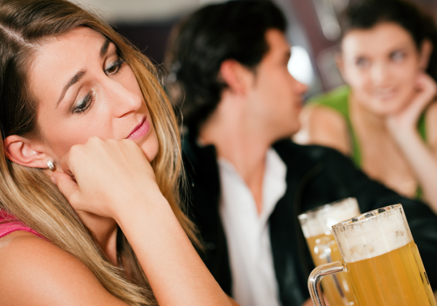 man talking to another woman on date Signs He's Pretending To Love You