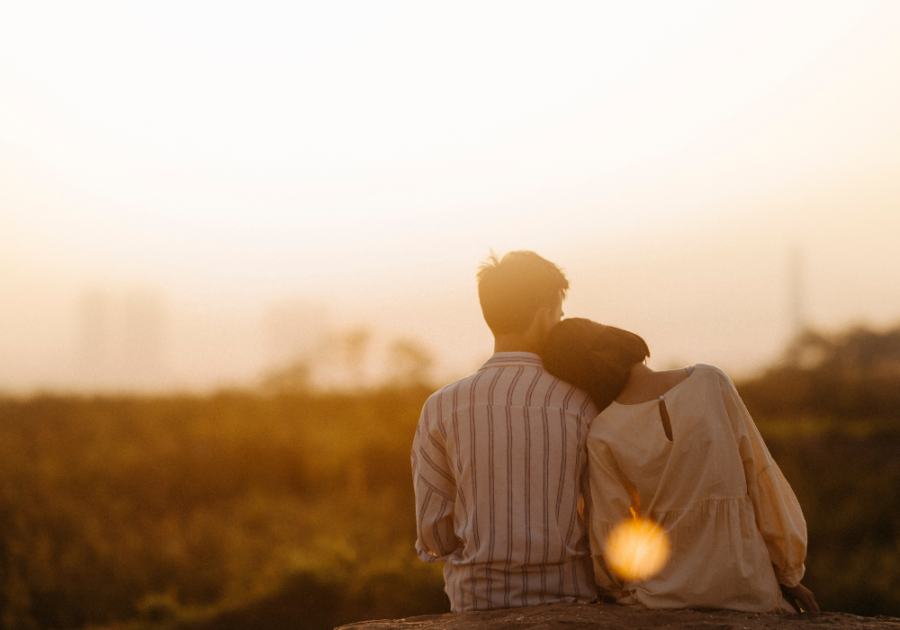 couple looking at sunset hero instinct