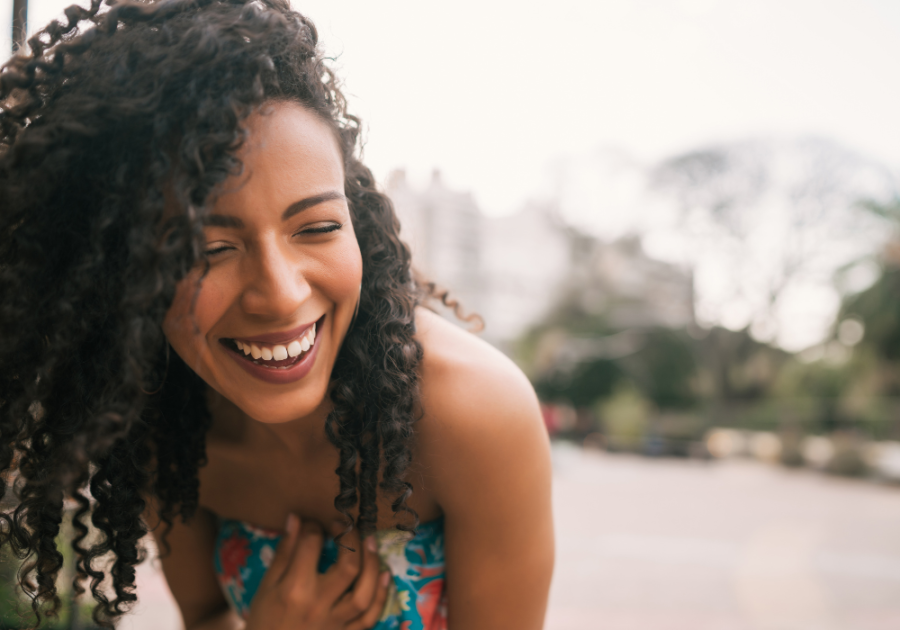 woman laughing alone  Masculine Vs. Feminine Energy