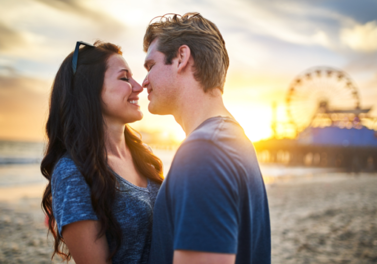 couple kissing on beach friends to lovers