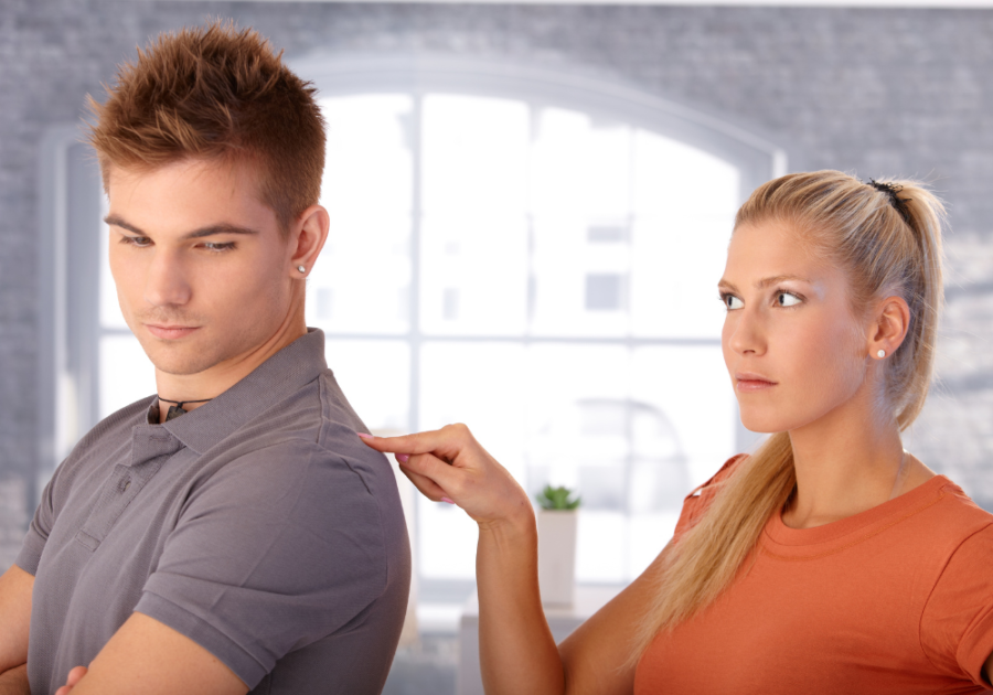 woman poking man in the back clingy girlfriend