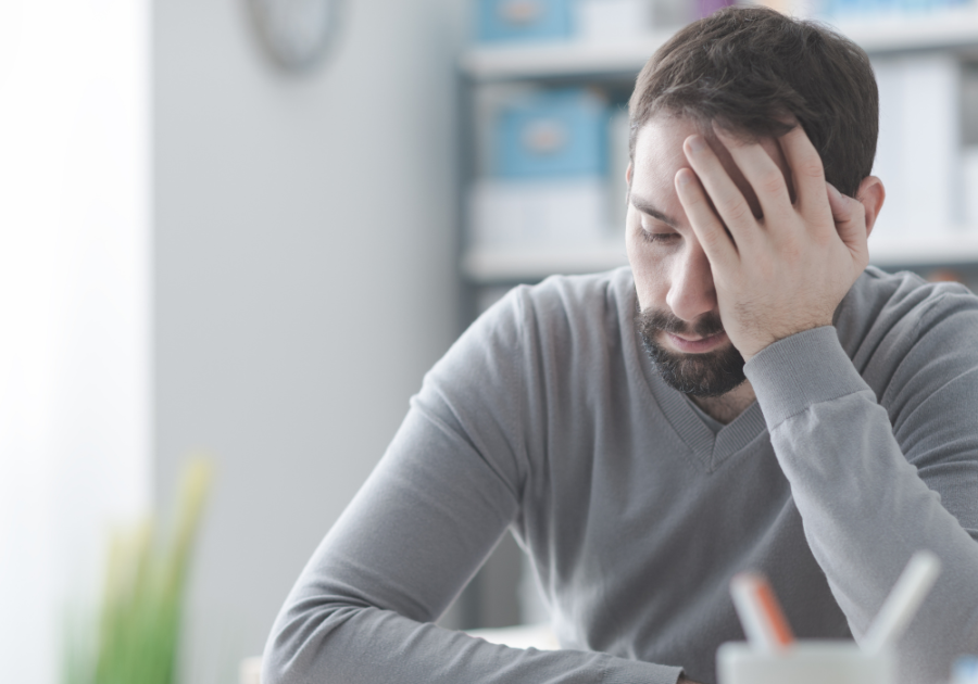 man looking sad sitting introvert hangover