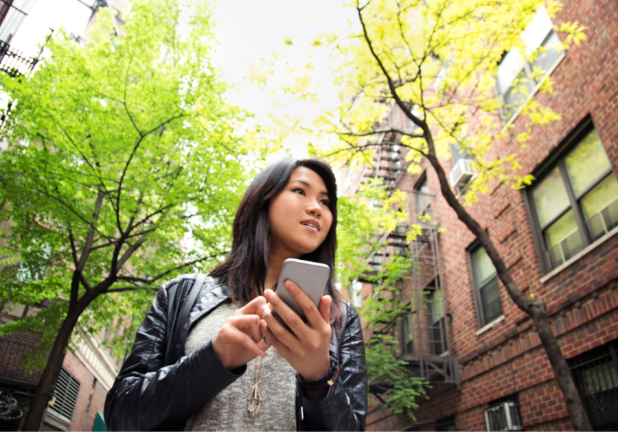 woman outdoors with phone New Things to Try