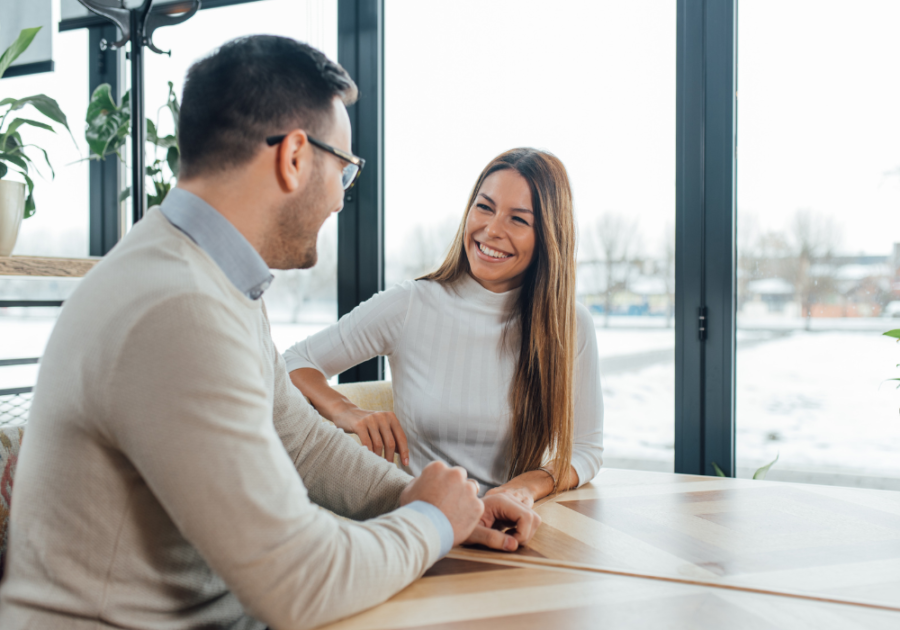 couple sitting at table laughing Dating After Divorce