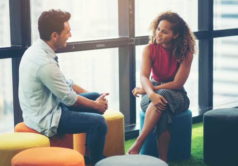 couple talking sitting beside big windows How to Validate Someone's Feelings