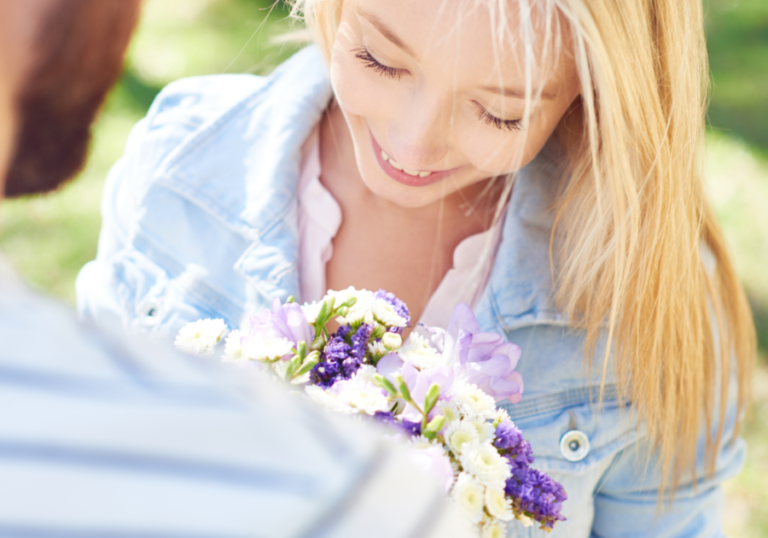 woman smiling holding flowers Dating After Divorce