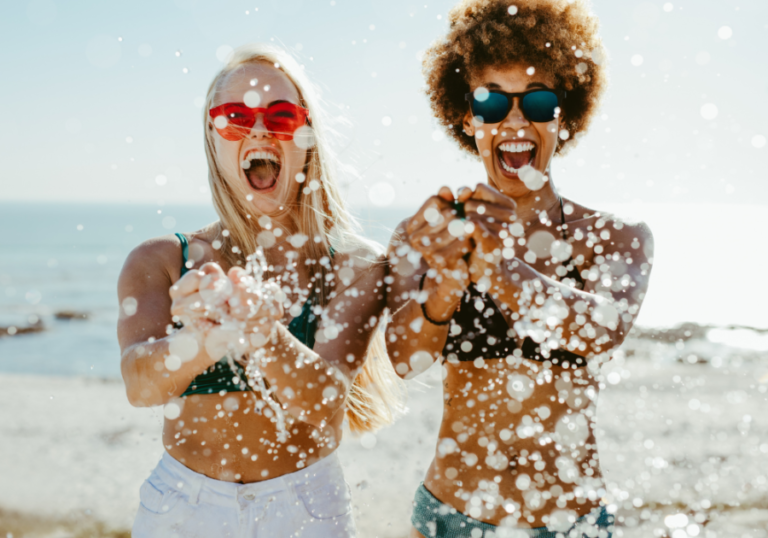 woman jumping laughing in ocean New Things To Try