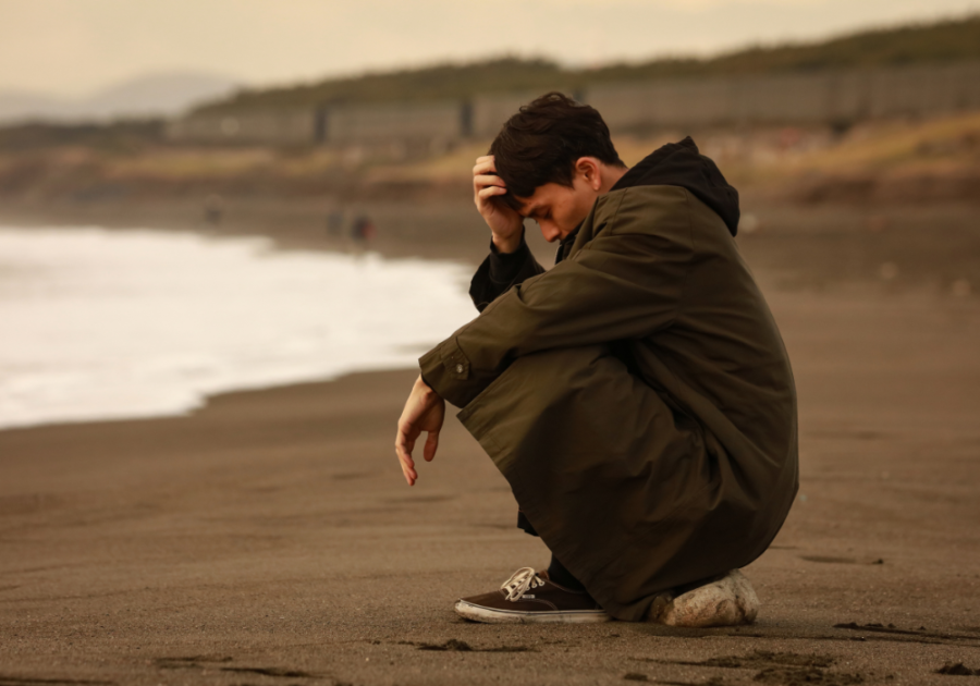 man alone on beach Signs You Are Unattractive