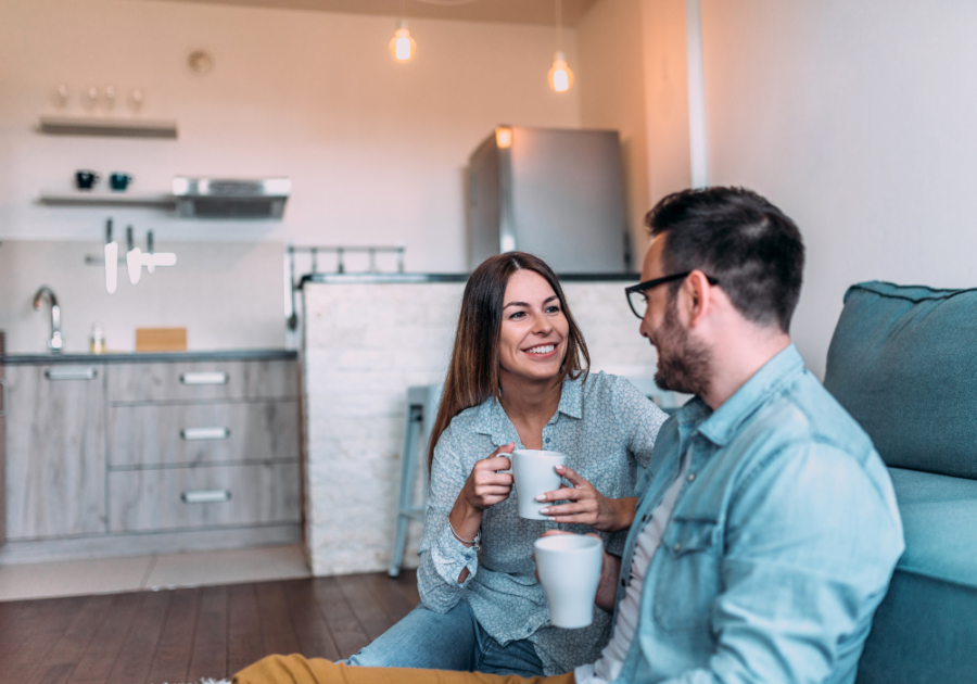 couple sitting beside sofa on floor talking Tough Relationship Questions