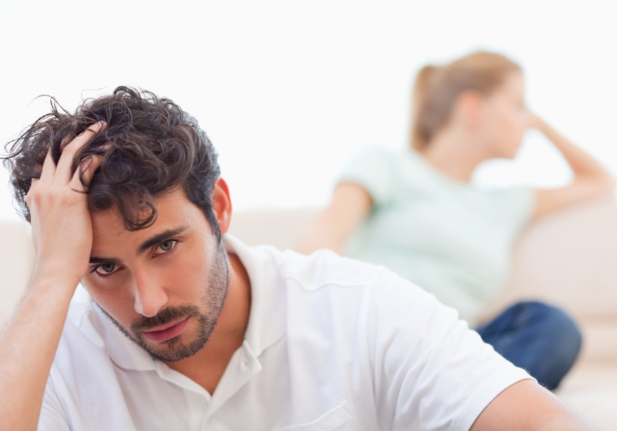 couple sitting away from each other sad Signs Your Marriage Is Making You Depressed