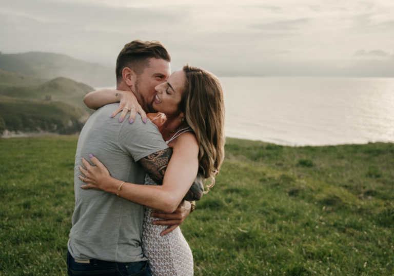 couple hugging near lake How to Be a Good Boyfriend