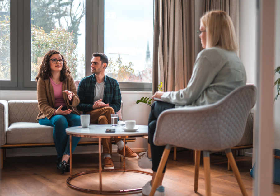 couple sitting in counseling session Losing Feelings