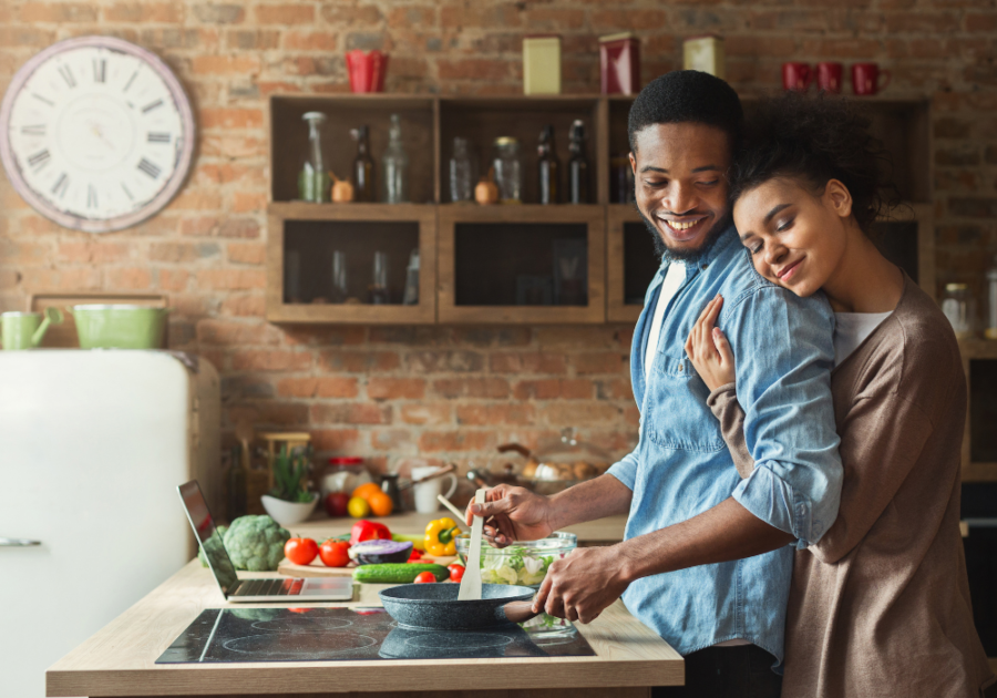 couple cooking in kitchen woman hugging him Respect Your Wife's Feelings