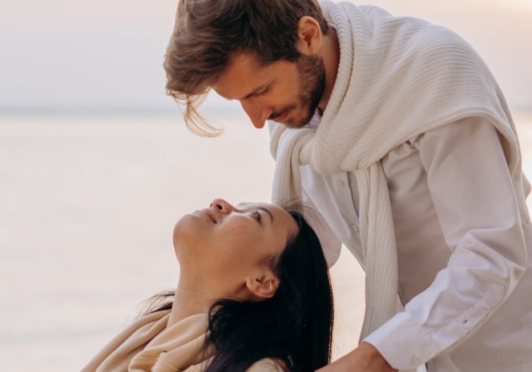 man looking at woman who is leaning back signs that a scorpio man has feelings for you