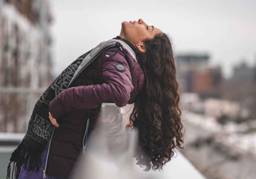 woman relaxing outside How to Emotionally Detach from Someone