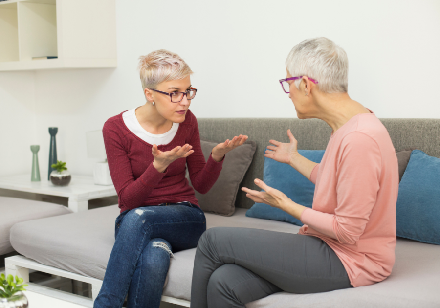 two women sitting on sofa arguing i hate my mom